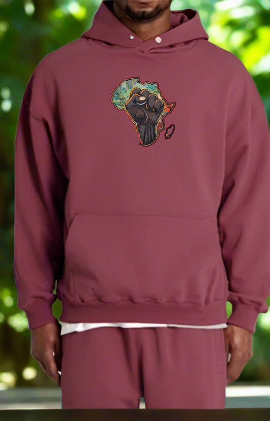 Maroon hoodie with a African Pride Power Embroidery – Empowerment Statement of a panther and Africa on a blurred green background