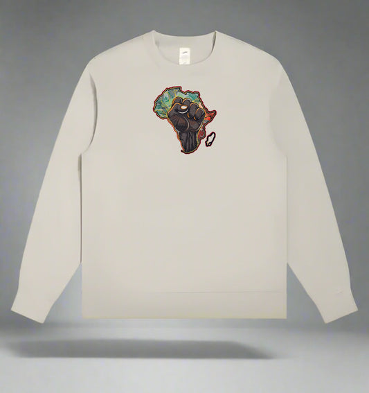 Beige long-sleeve shirt with a African Unity Fist Embroidery – Empowerment design on a gray background