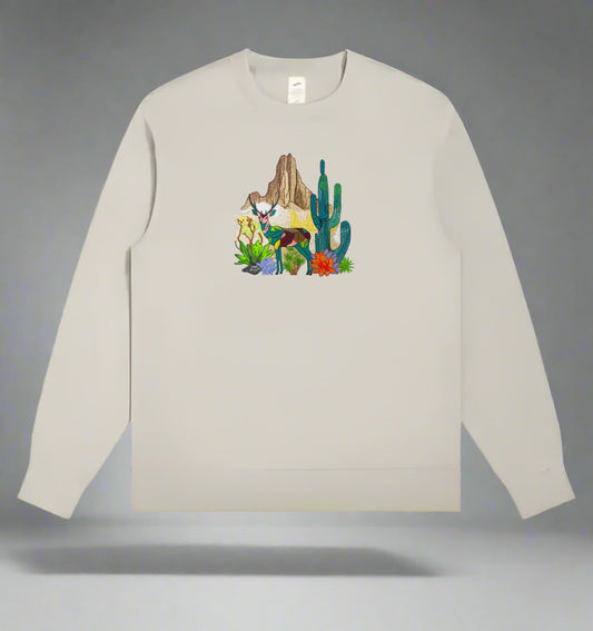 Embroidered sweatshirt with a design featuring a mountain deer and cactus.
