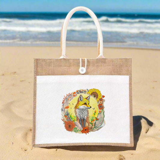 Embroidery art of a golden fox surrounded by autumnal foliage on a tote bag.