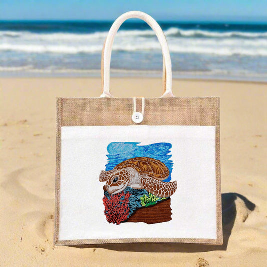 Embroidered sea turtle design on a jute tote bag