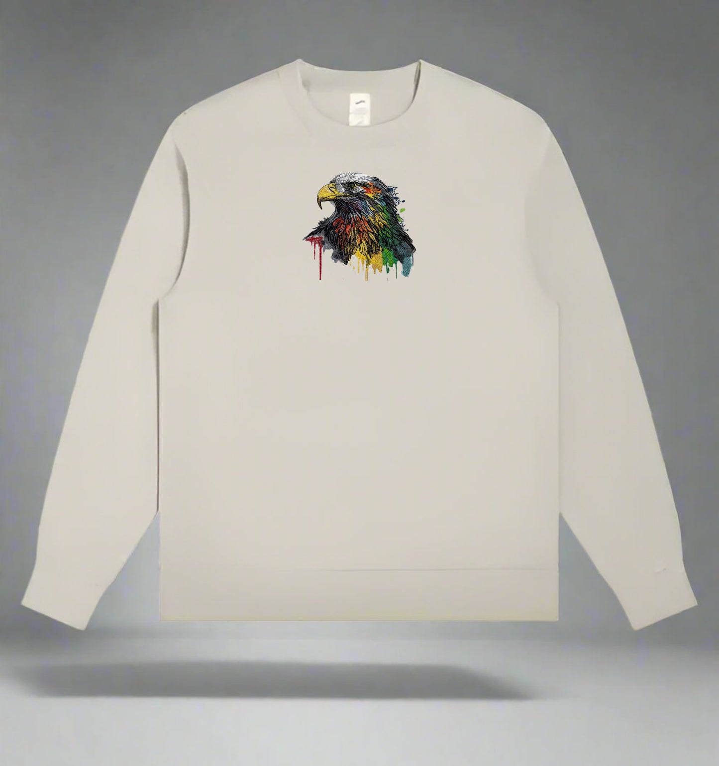 Beige long-sleeve sweatshirt with a colorful eagle design on a gray background