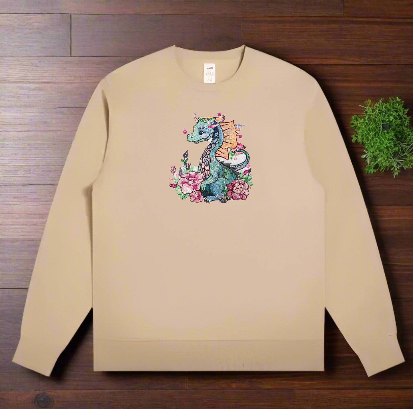 An embroidery design of a colorful dragon surrounded by floral elements and a detailed description of the design is presented.