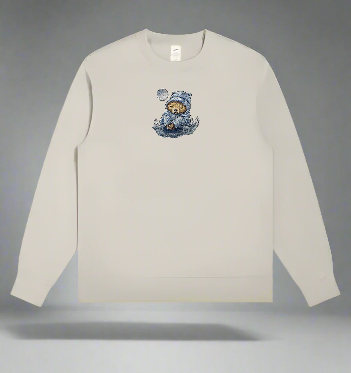 Mint Green long-sleeve sweatshirt with a Moonlit Sloth Embroidery – Dreamy Chill on a gray background