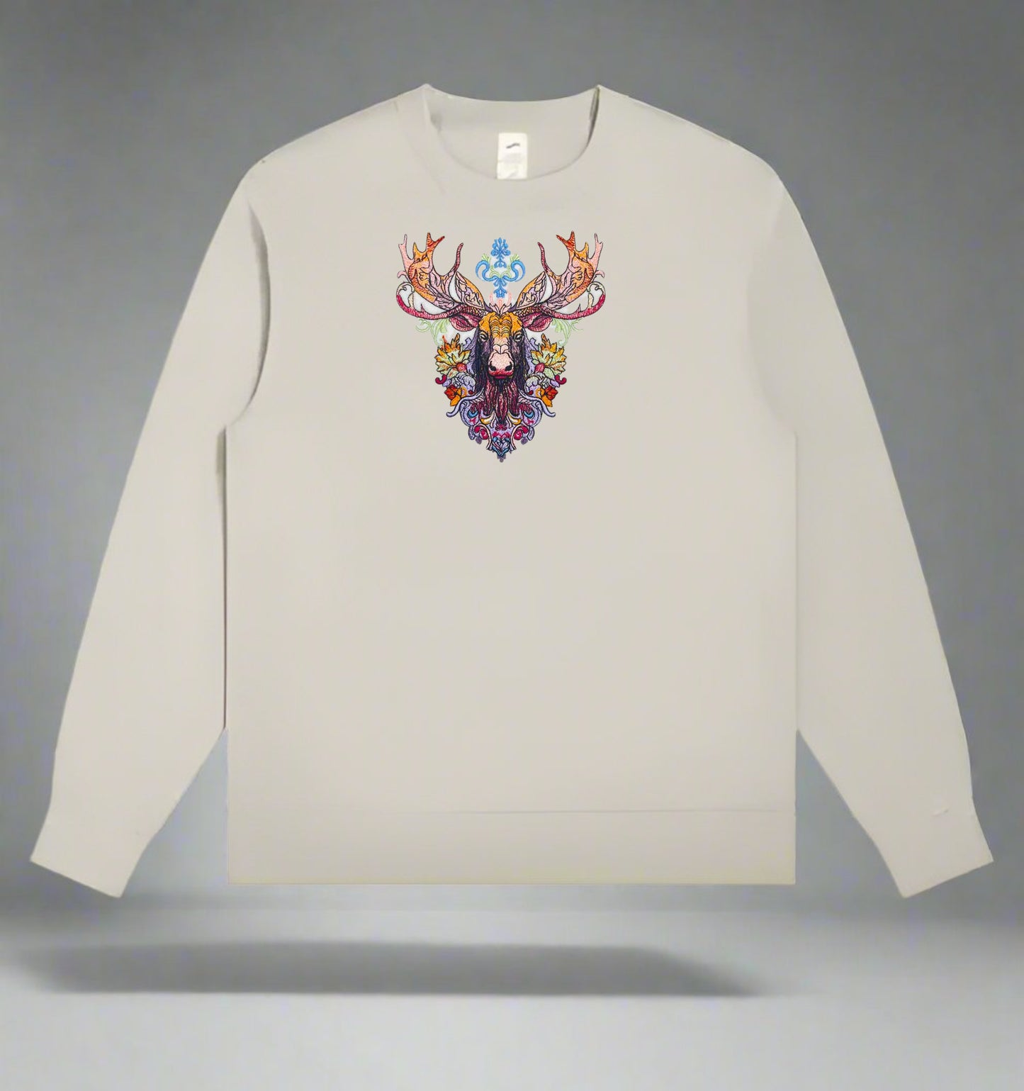 A detailed embroidered image of a moose with wildflowers on a sweatshirt.