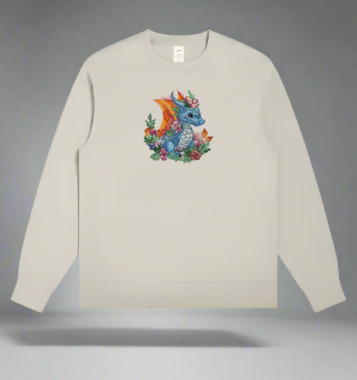 A colorful embroidery design of a dragon surrounded by floral elements and a detailed background.