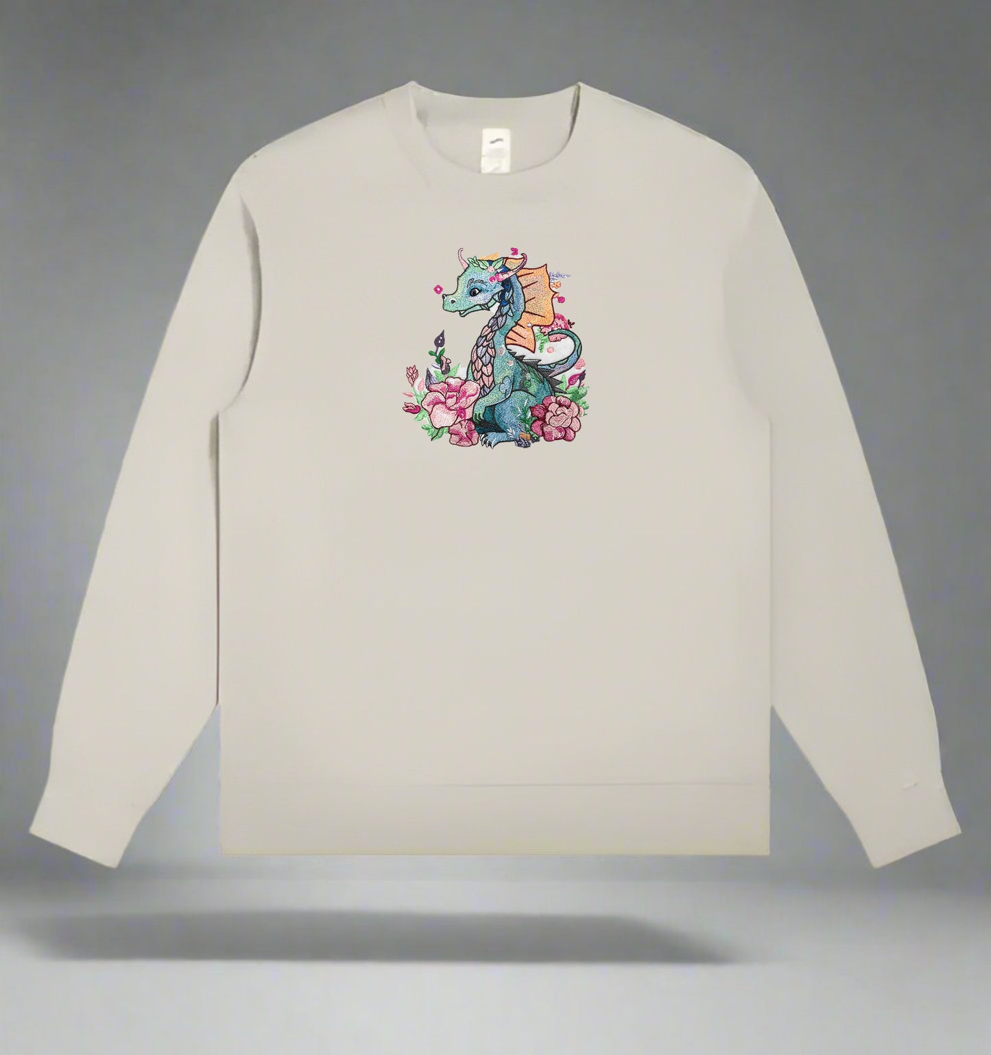 An embroidery design of a colorful dragon surrounded by floral elements and a detailed description of the design is presented.