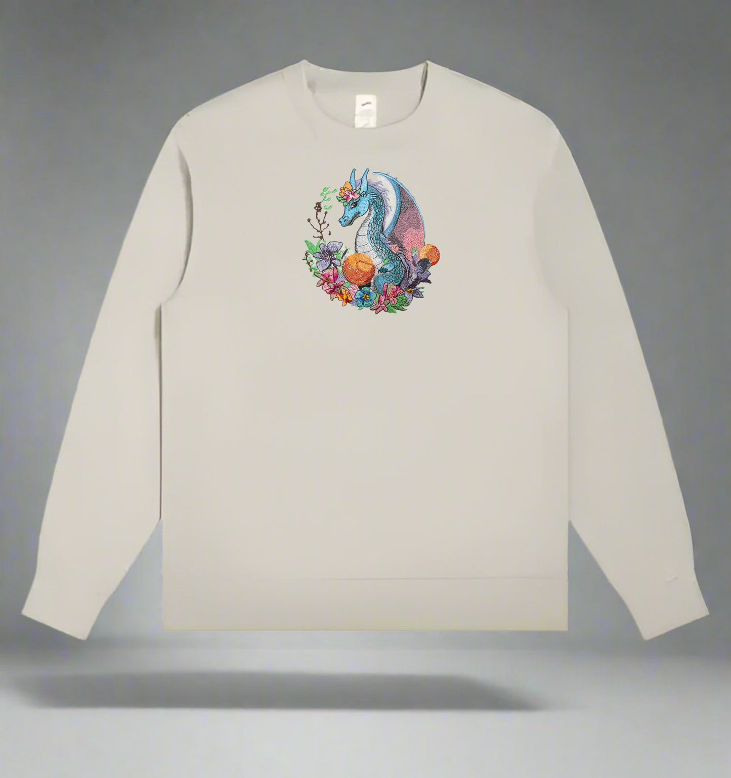 A colorful embroidery design of a dragon surrounded by various flowers and plants.