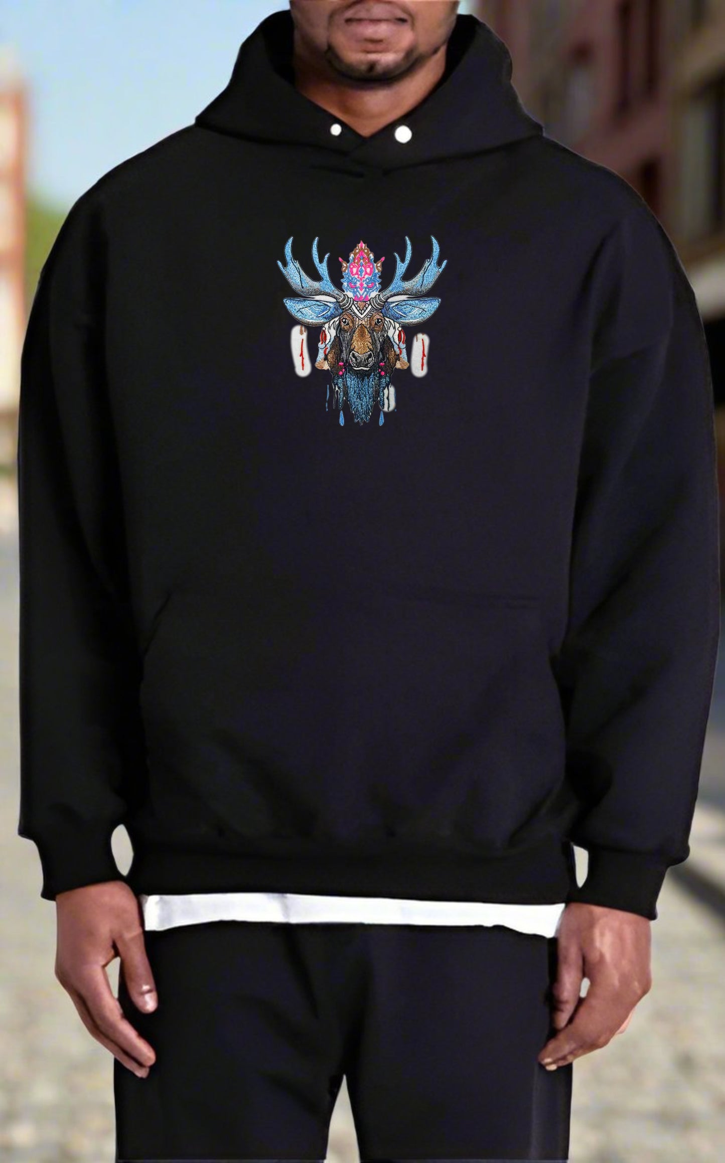 Embroidered hoodie featuring a detailed moose design with Nordic-inspired patterns, metallic gold and silver threads, and snowflake motifs.