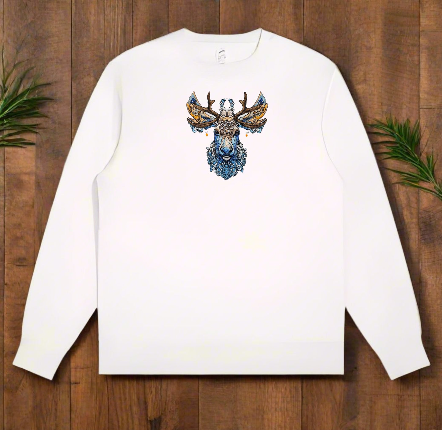An embroidered image of a deer with intricate antlers and a detailed face featuring blue and brown colors.