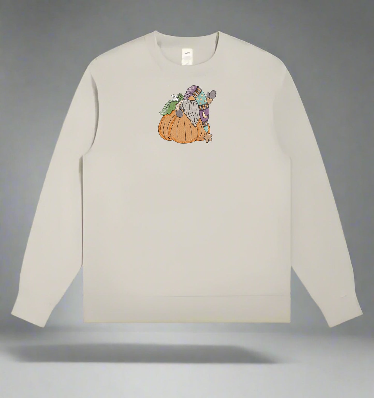 Mint Green long-sleeve sweatshirt with a graphic of a wizard and pumpkin on a gray background