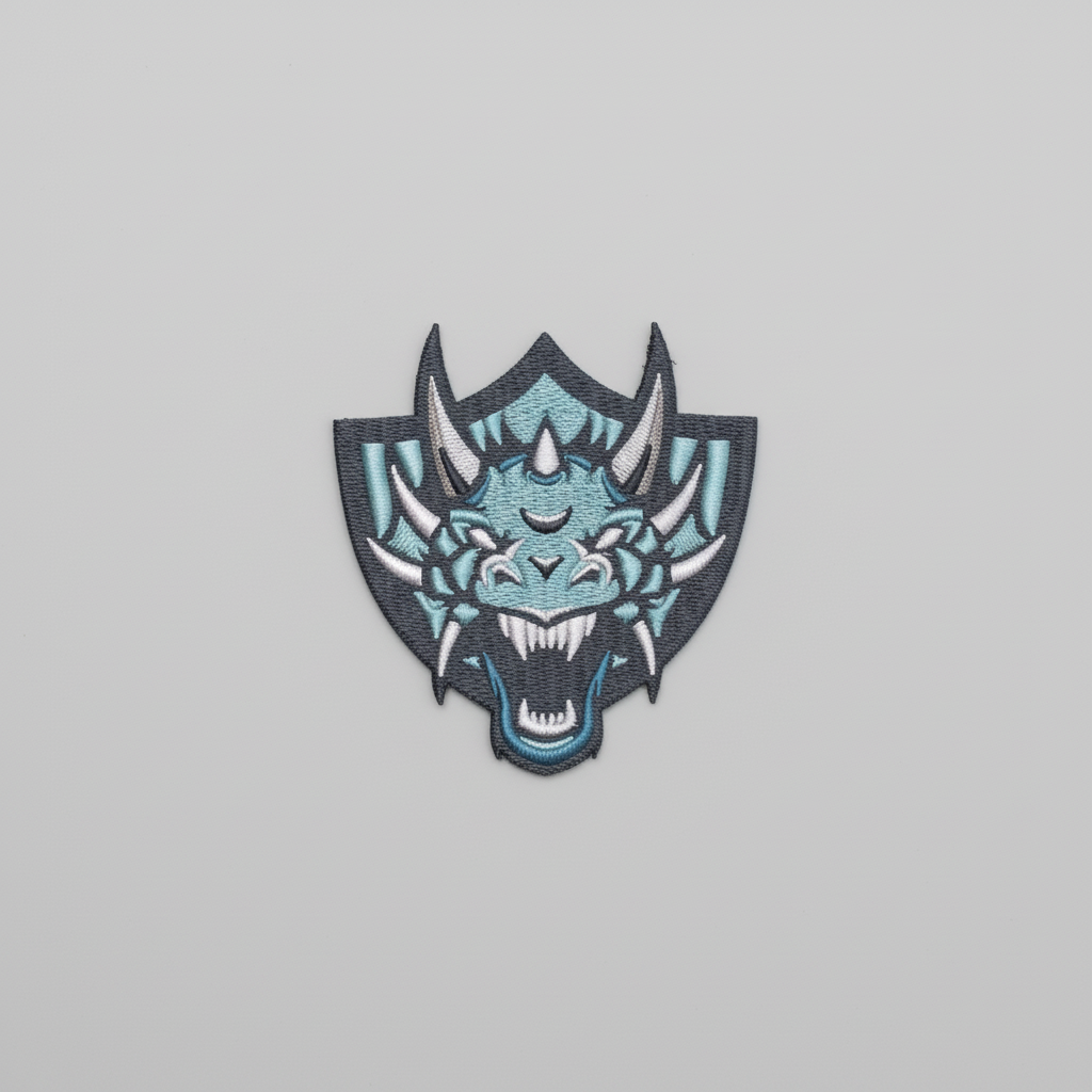 Embroidered dragon design on a grid background