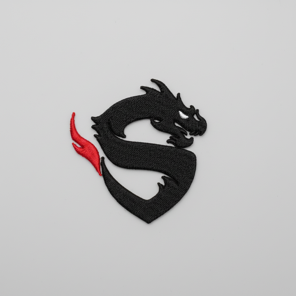 Black dragon design with a red tail on a grid background