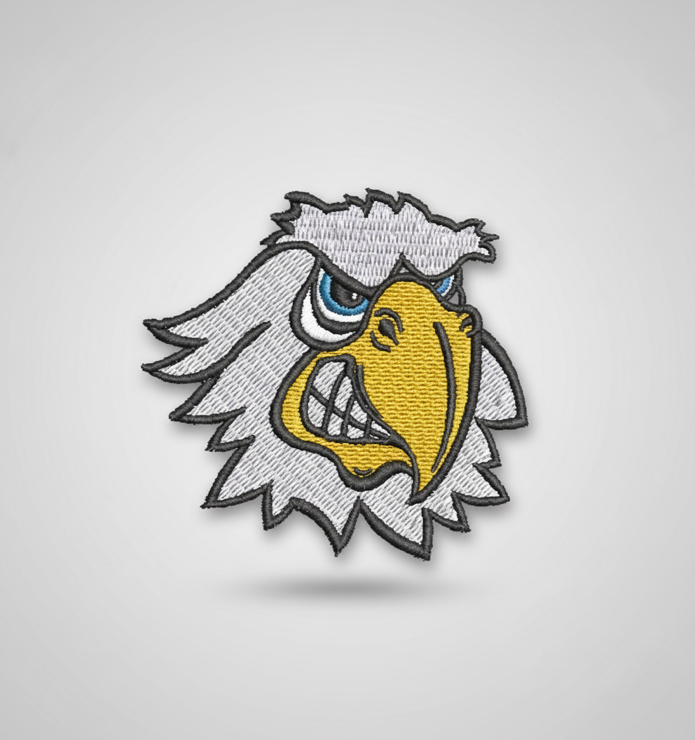 Embroidered design of a hawk head with a grid background