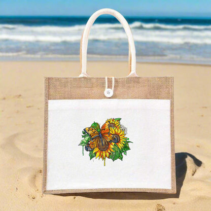 An embroidered tote handbag featuring a sunflower and butterfly design on a jute fabric.
