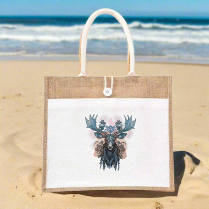 Embroidered moose head design on a beige jute tote bag, featuring intricate antlers with metallic thread accents and botanical motifs.