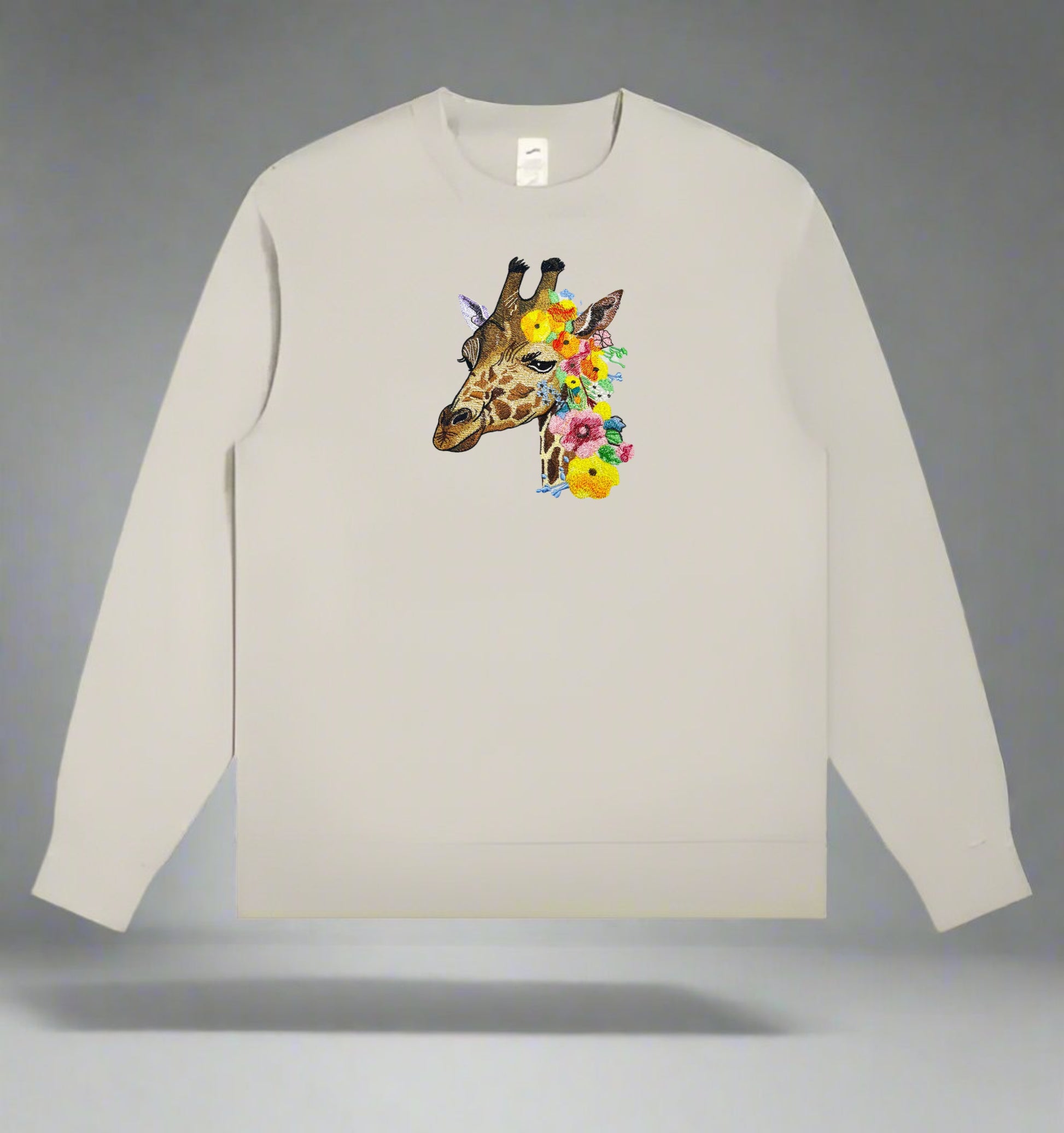 A embroidery design of a giraffe with a floral pattern.