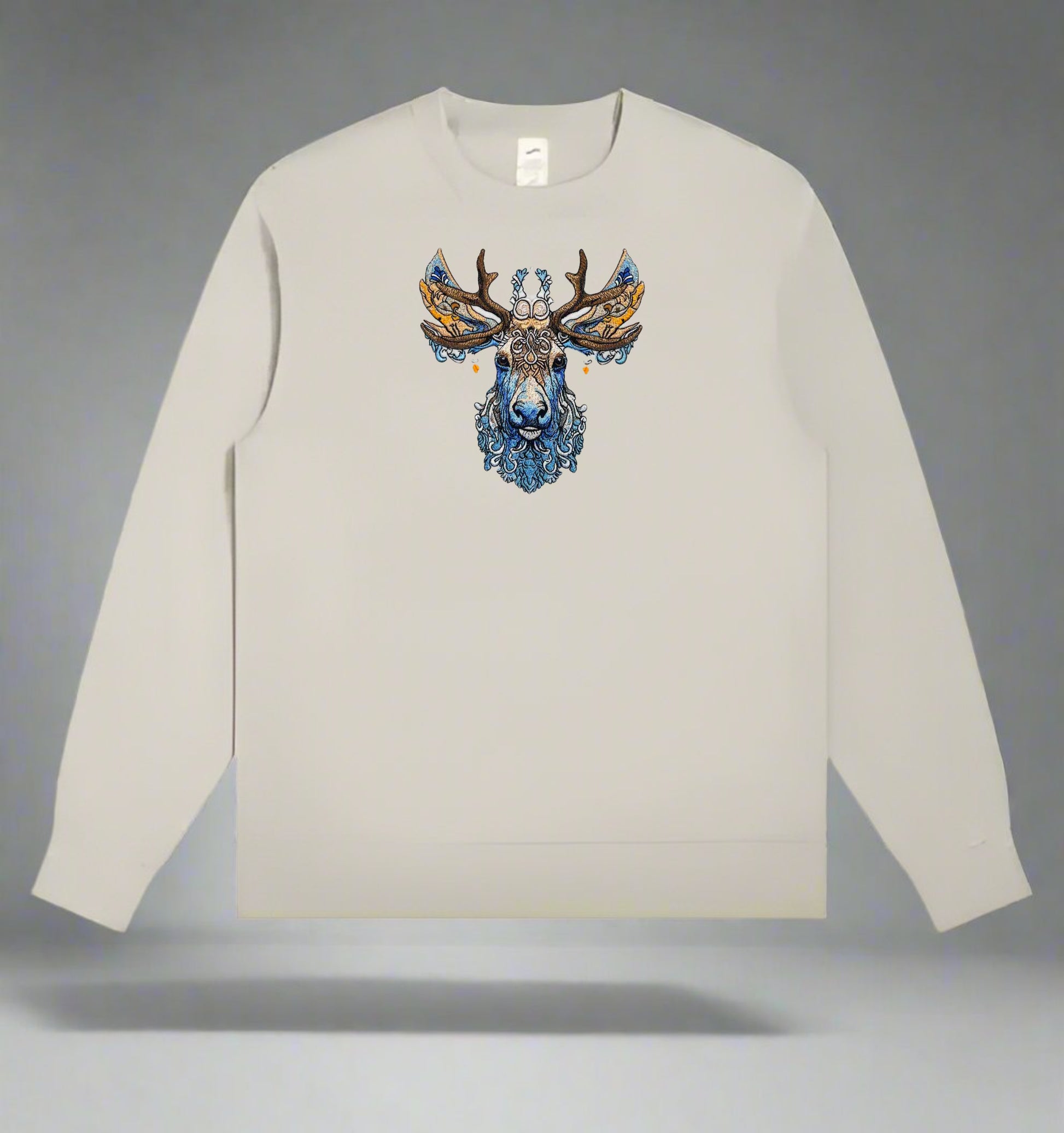 An embroidered image of a deer with intricate antlers and a detailed face featuring blue and brown colors.