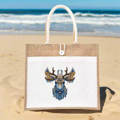 Embroidery of a deer with intricate floral patterns on a beige jute tote bag.