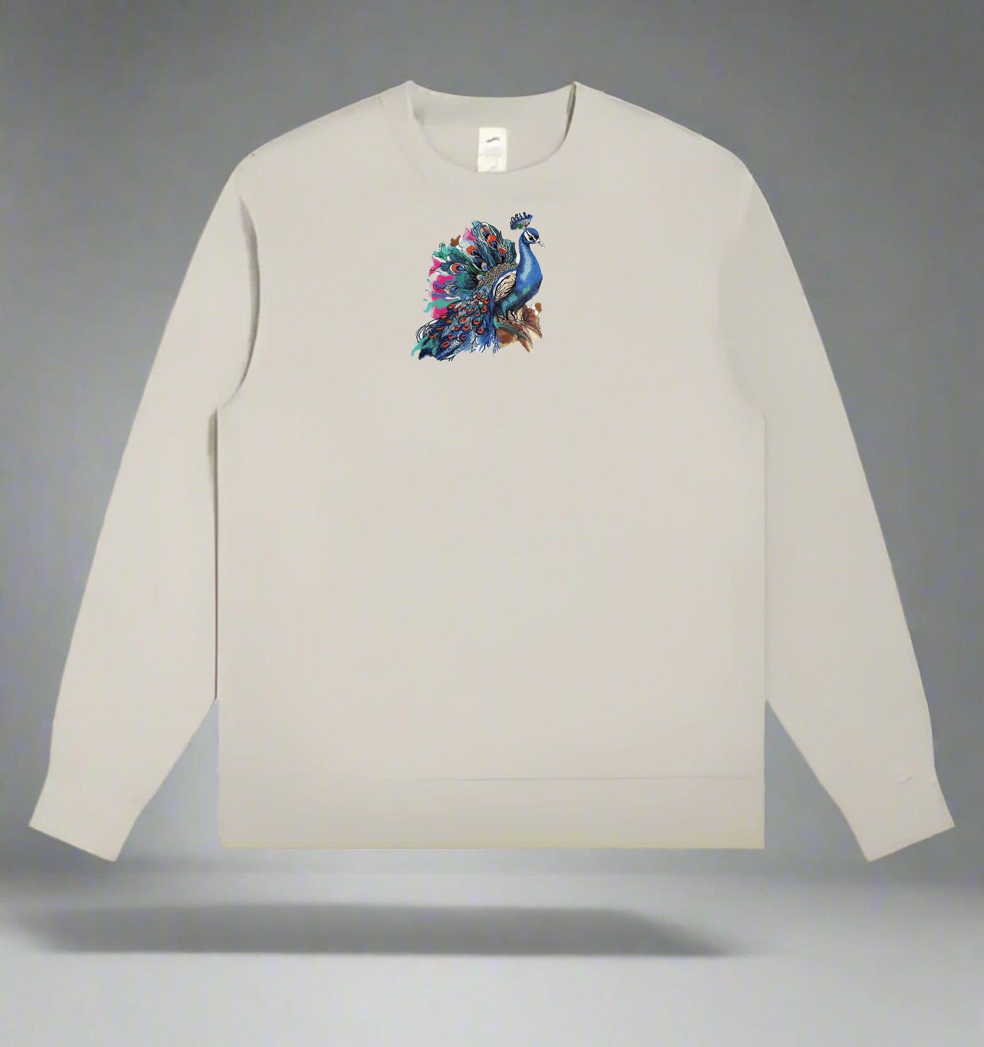 Mint green  long-sleeve sweatshirt with a colorful peacock design on a gray background