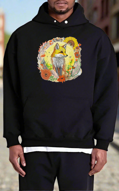 Embroidered hoodie featuring a golden fox surrounded by floral patterns, predominantly in shades of yellow, orange, and green.