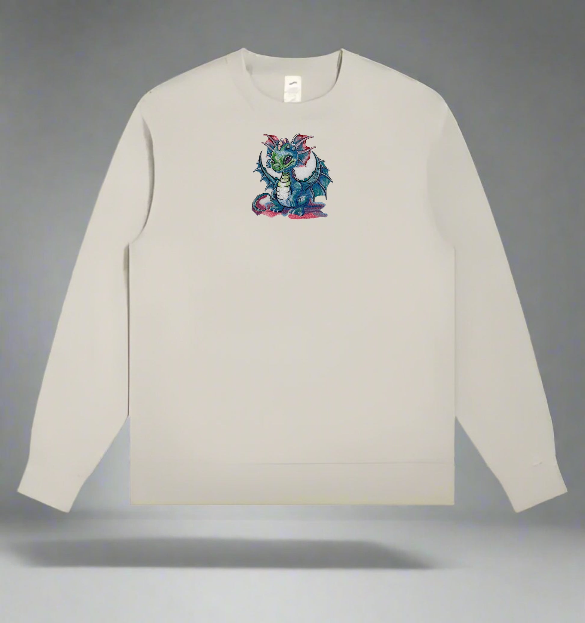 Mint green  long-sleeve sweatshirt with a colorful dragon design on a gray background