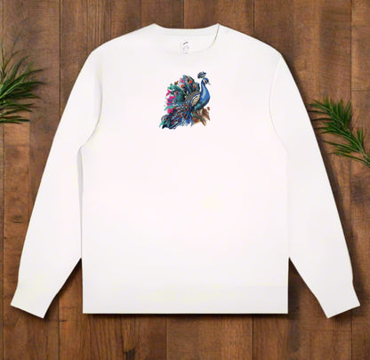 White long-sleeve sweatshirt with a colorful peacock design on a wooden surface.