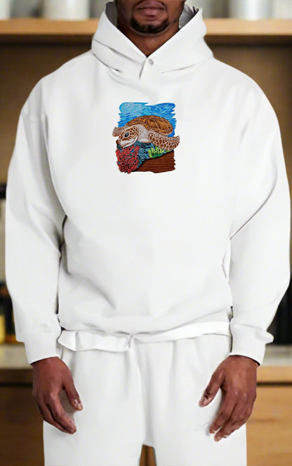 Person wearing a white hoodie with a colorful graphic design on a wooden shelf background