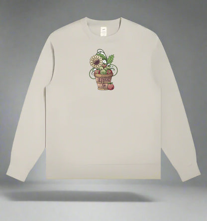 Beige long-sleeve shirt with a floral design on a gray background