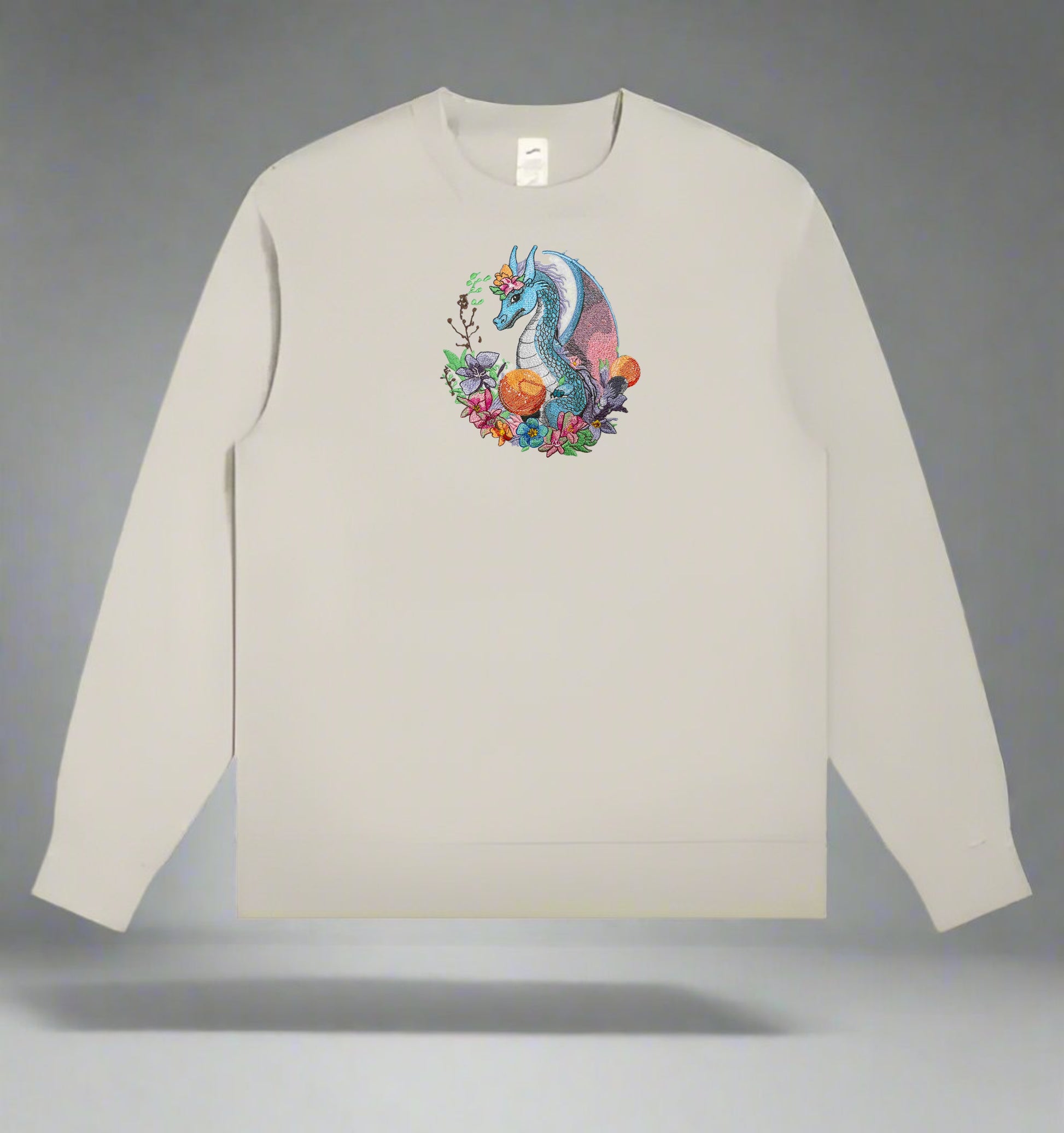 A colorful embroidery design of a dragon surrounded by various flowers and plants.