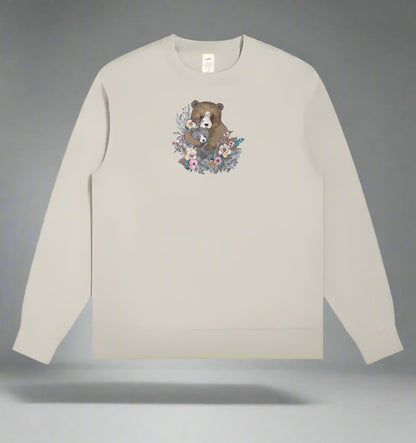 Mint green  long-sleeve sweatshirt with a bear and floral design on a gray background