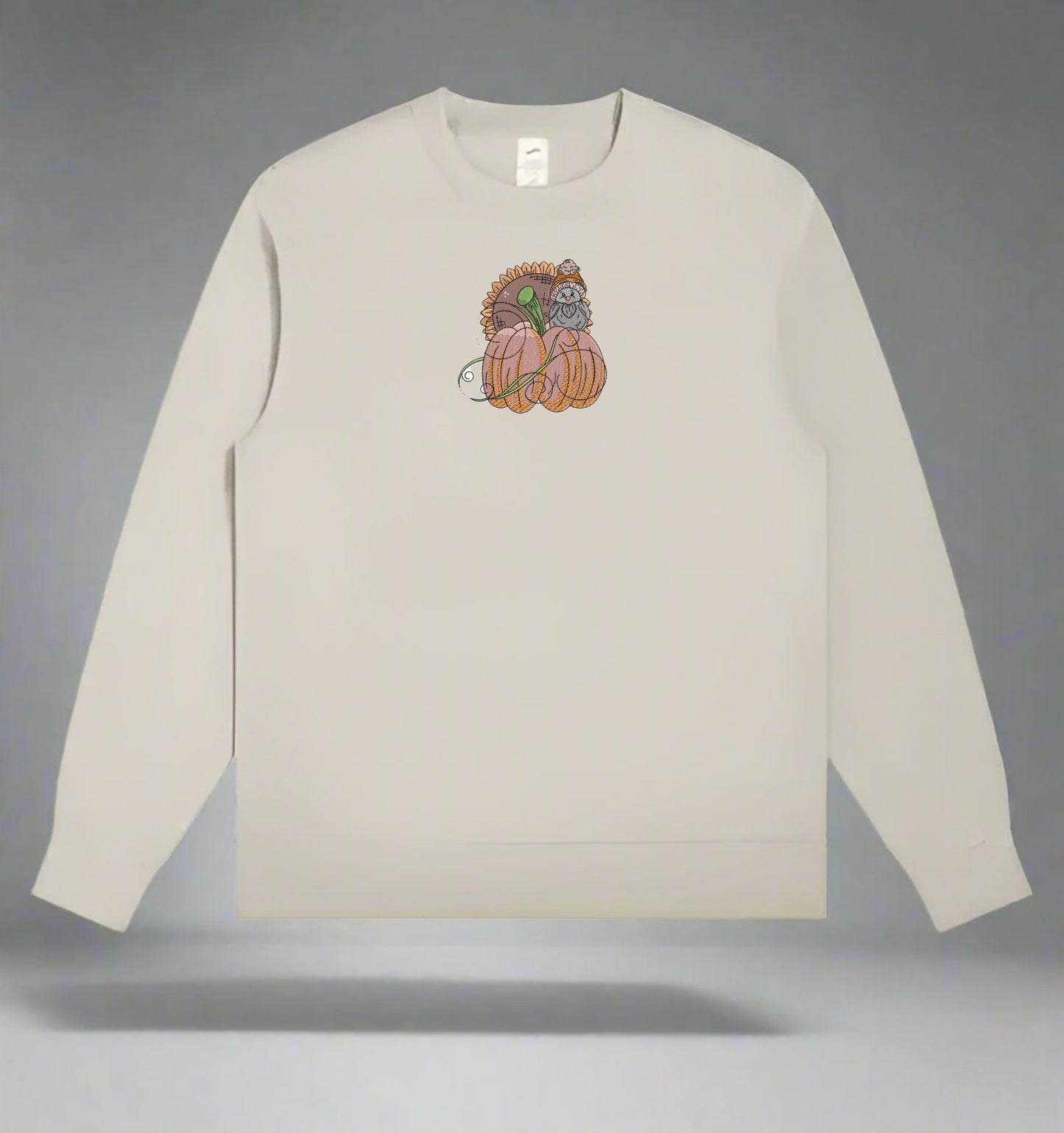 Mint Green long-sleeve sweatshirt with a  Pumpkin Bird & Sunflower Embroidery Design on a gray background