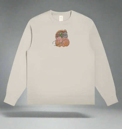 Mint Green long-sleeve sweatshirt with a  Pumpkin Bird & Sunflower Embroidery Design on a gray background