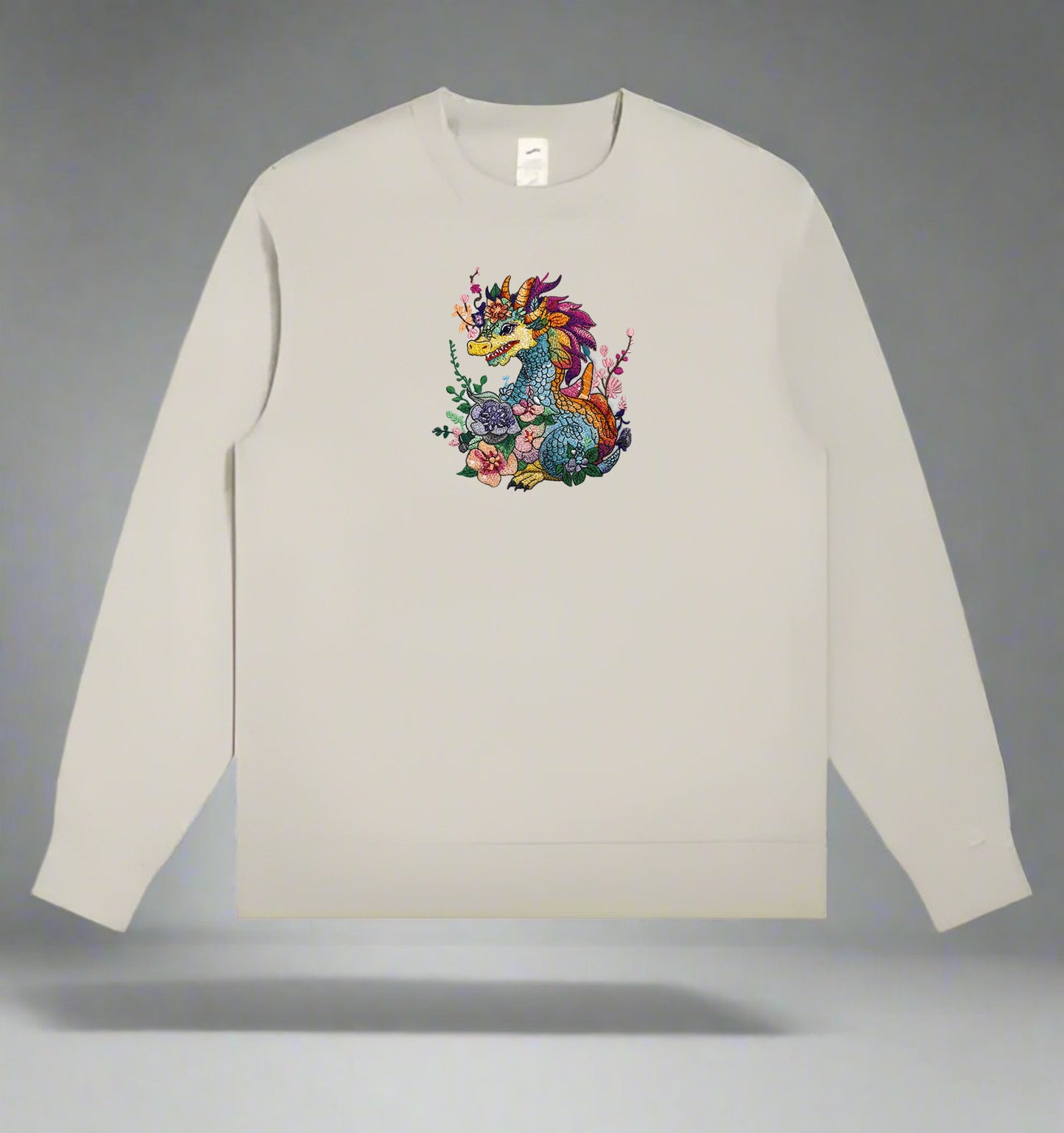 A colorful embroidery design of a dragon with floral elements and a detailed mane and tail.