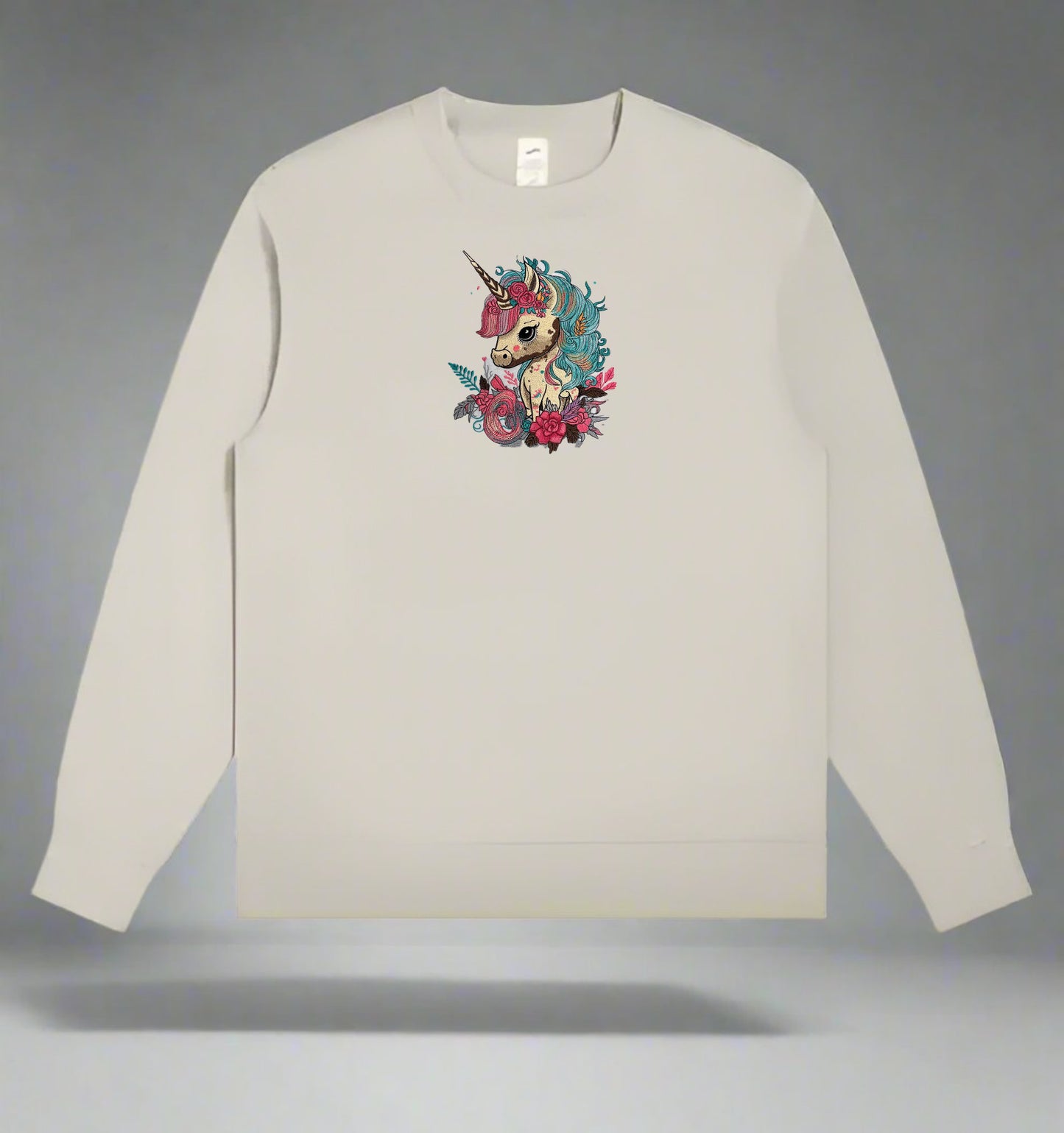 Mint green long-sleeve sweatshirt with a  Whimsical Unicorn Floral Embroidery – Magical Dreams on a gray background