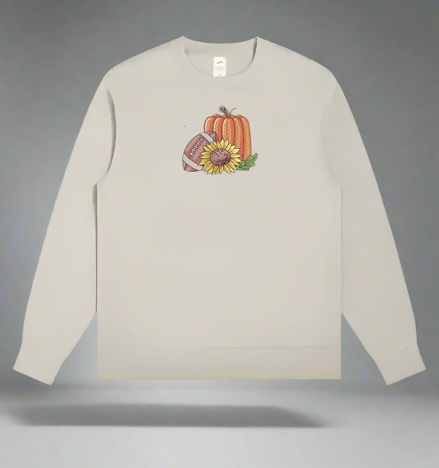 Mint Green long-sleeve sweatshirt with a pumpkin and sunflower design on a gray background