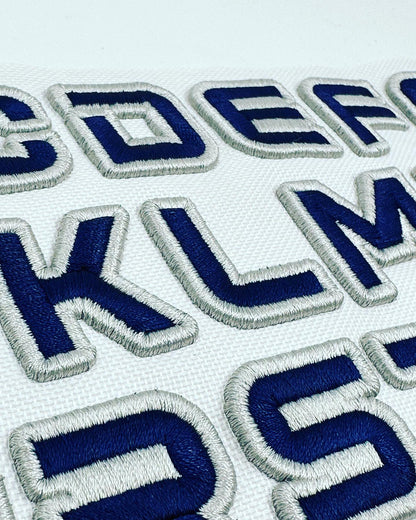 Embroidered letters on a white background
