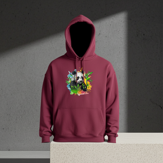 Burgundy hoodie mockup featuring an embroidered panda with bamboo leaves and colorful splash accents on the chest, displayed against a minimalist concrete background.