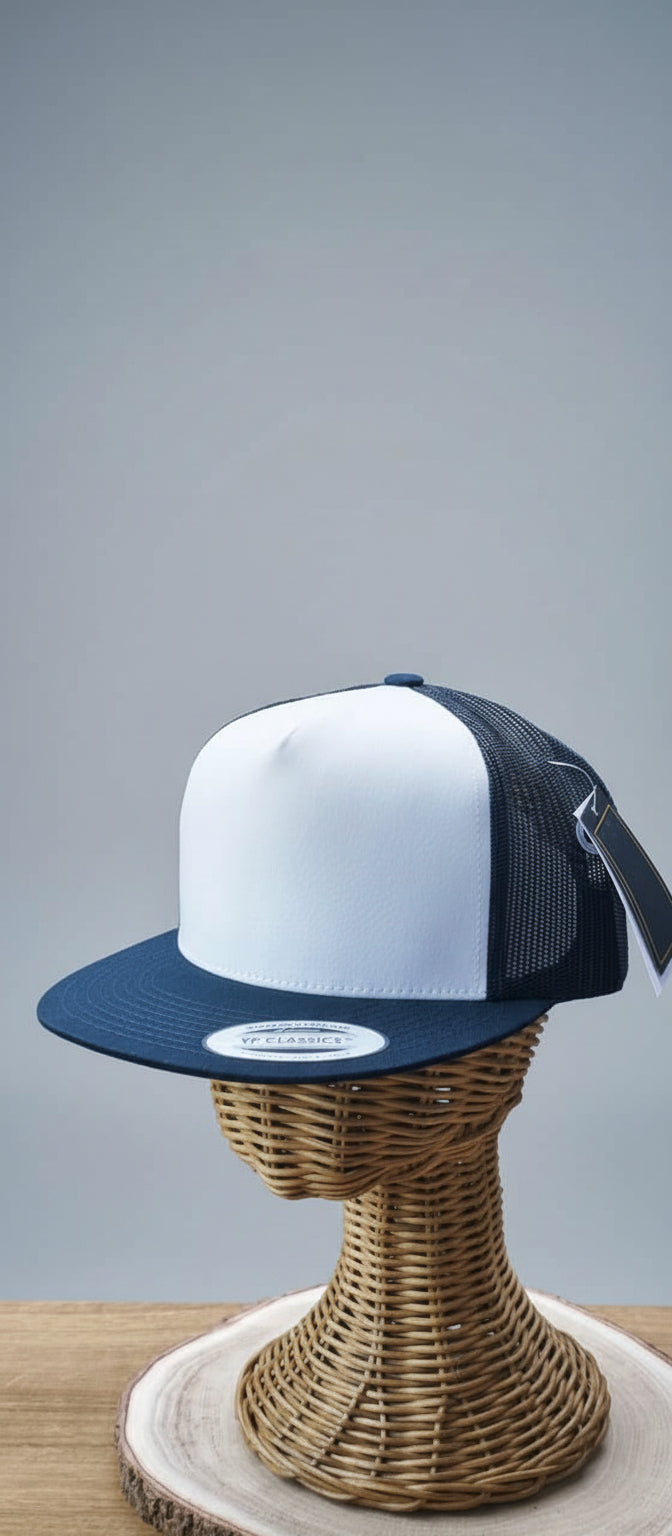White and navy cap on a wicker stand with a blurred indoor background