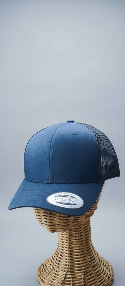 Blue cap on a mannequin head with a blurred indoor background