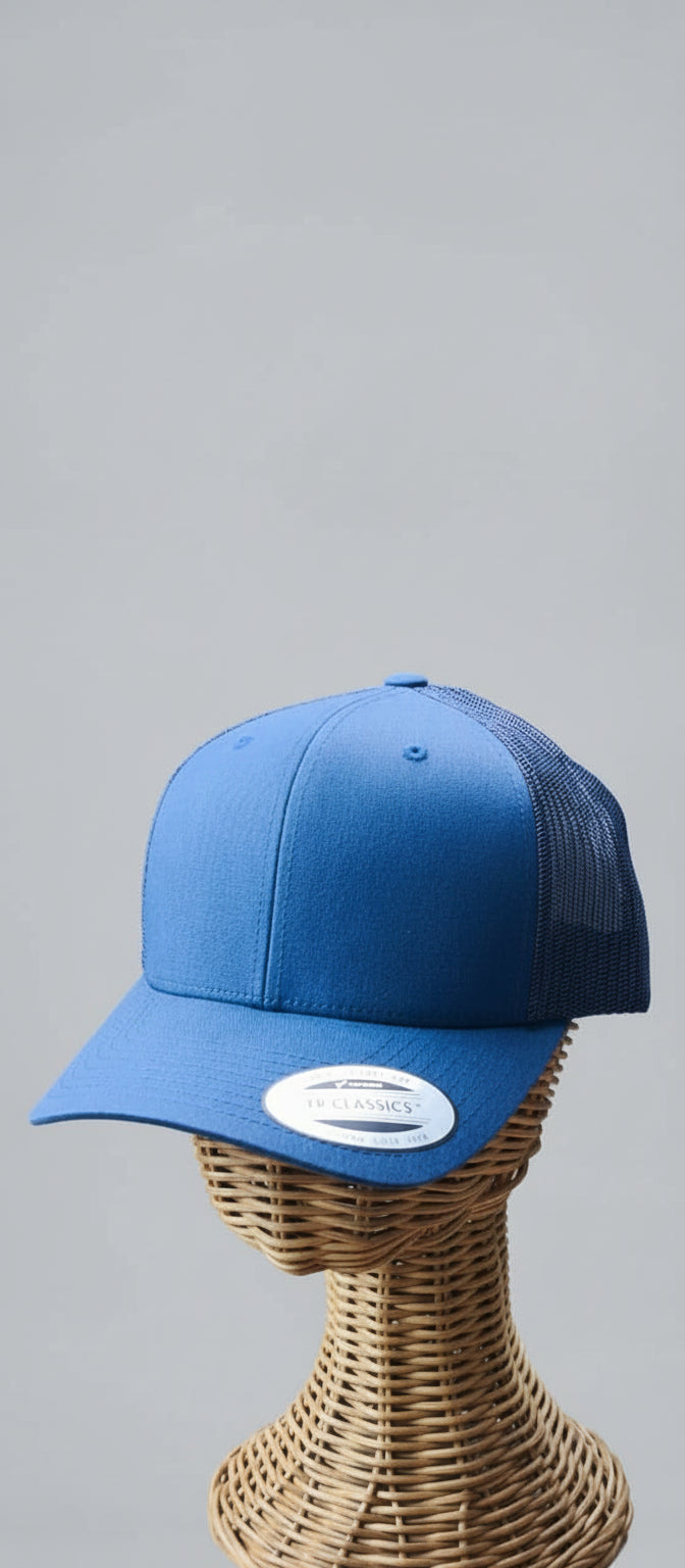 Blue cap on a mannequin head with a blurred background