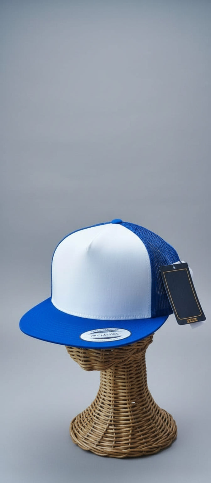 Blue and white cap on a wicker stand with a blurred indoor background