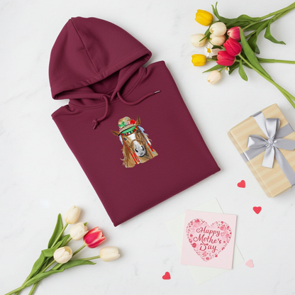 
Burgundy hoodie mockup featuring an embroidered boho western horse wearing a decorated hat on the chest, styled flat lay with tulips, a gift box, and a Mother’s Day card.
