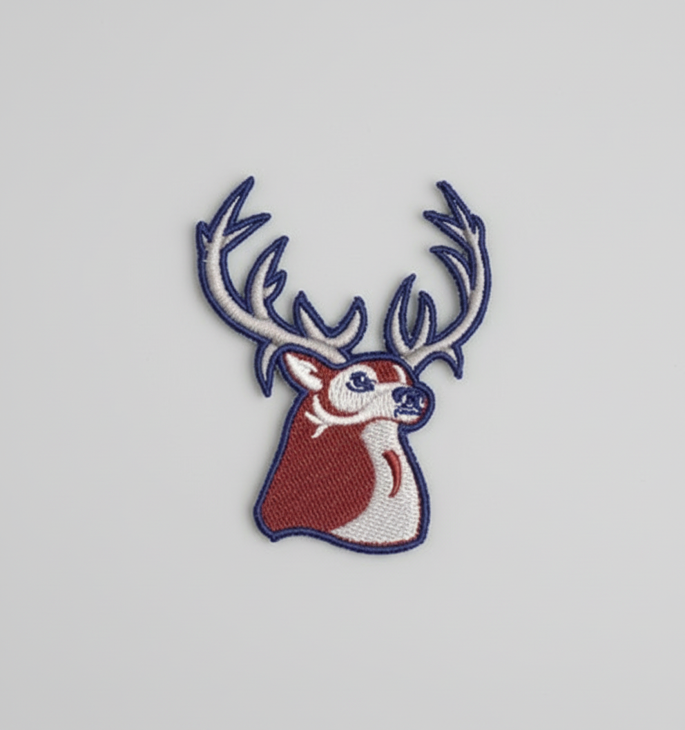 Embroidered Buck head design on a grid background