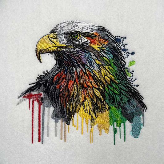 Colorful embroidery design of an eagle with a modern color cascade style on a white background.