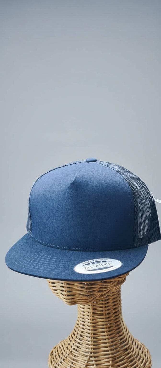Blue trucker cap on a mannequin head with a blurred background