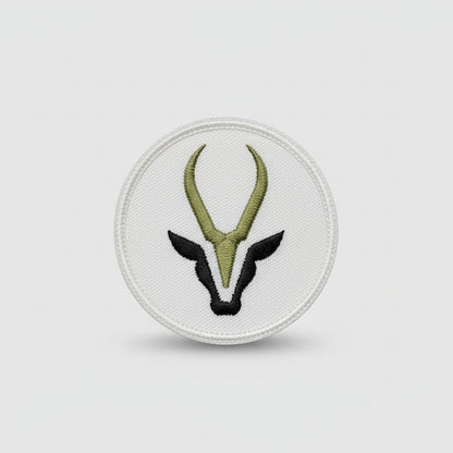 Logo with black antelope head and gold antlers on a white background