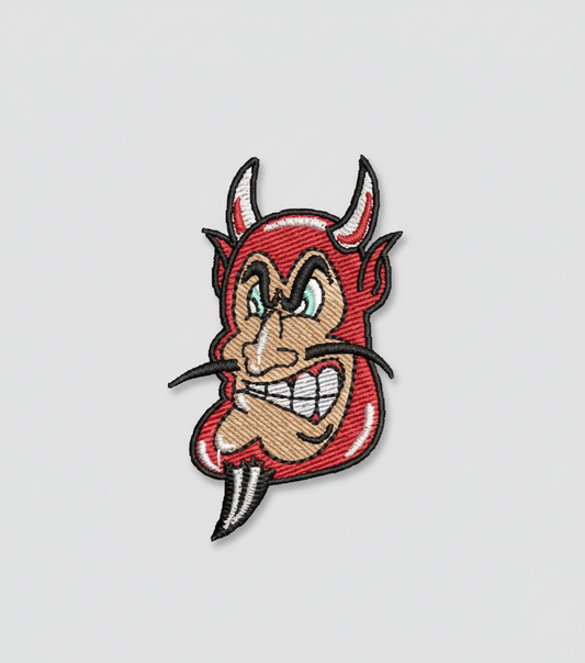 Embroidered patch of a cartoonish devil face on a grid background
