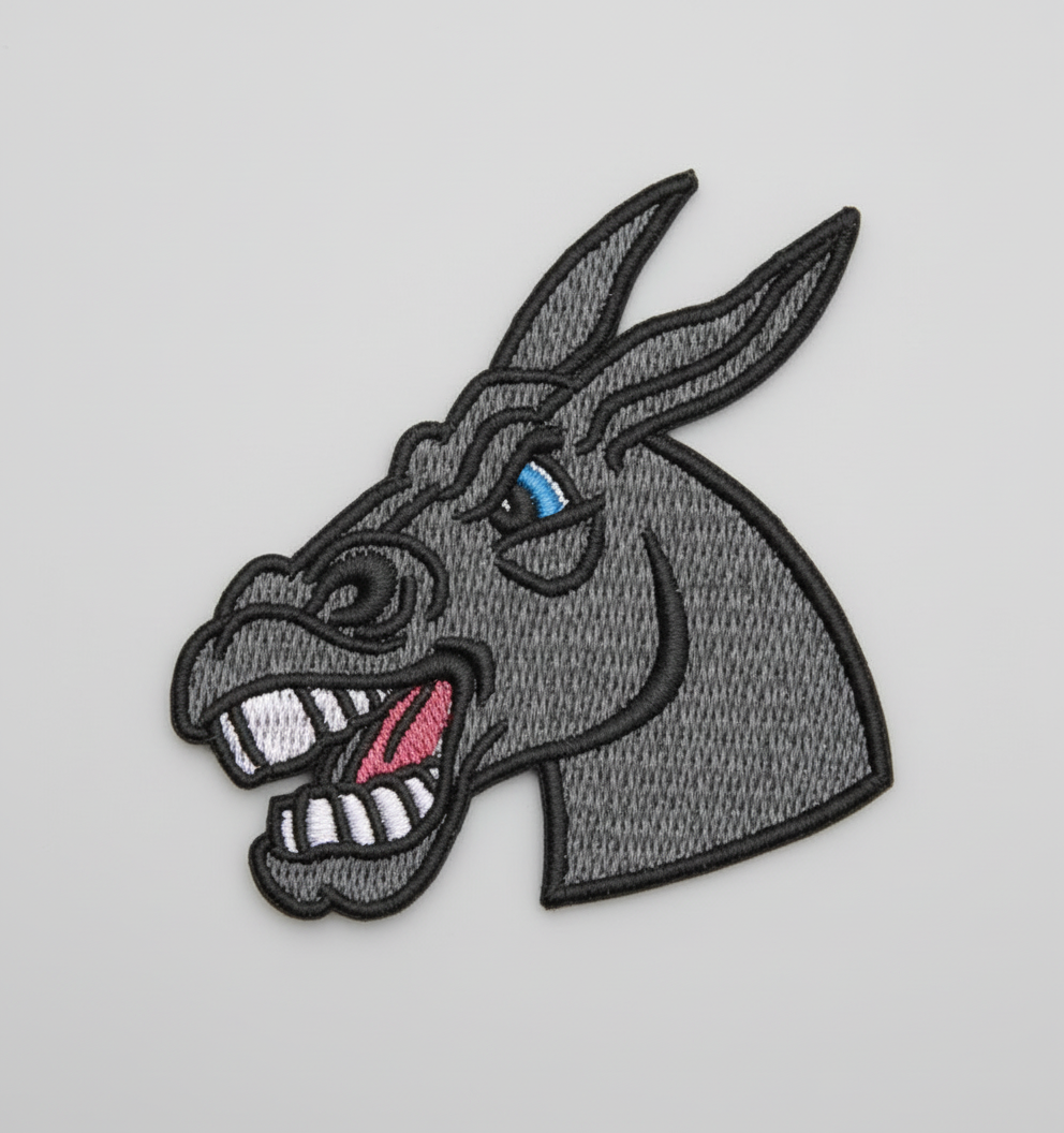 Embroidered donkey  head patch on a grid background