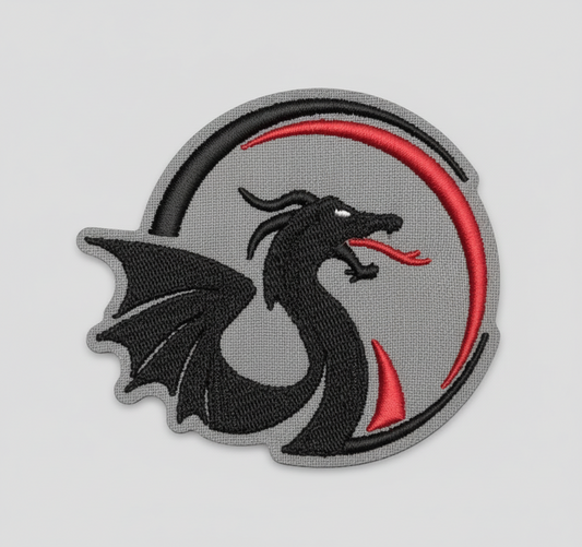 Black dragon design with a red circle on a grid background